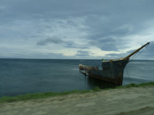 An old ship pushed up on the shoreline